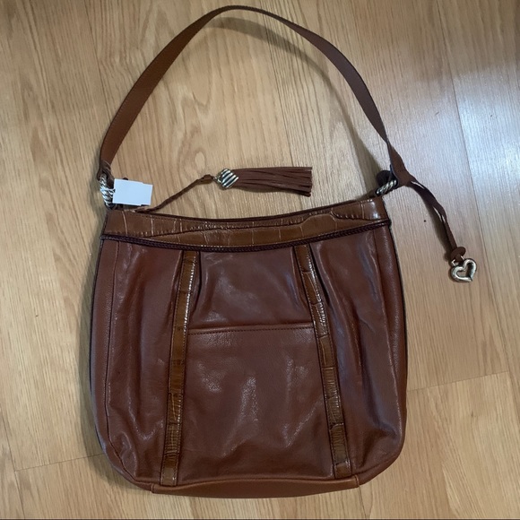 Brighton
Shoulder Bag Brown Leather Satchel
11"L x 3.5"W x 12"H - Picture 2 of 7